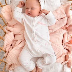 Baby Sleeping In a Personalised Butterlfy Onesie.