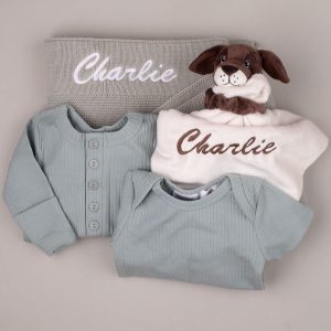 Personalised sage baby blanket with green ribbed rompers and puppy comforter embroidered “Charlie.”