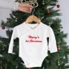Personalised 1st Christmas Cotton Romper. Henry Personalised white knitted wraparound romper with Henry’s 1st Christmas embroidered in red hanging on wooden hanger