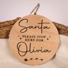Santa, Please Stop Here Personalised Disc Round birch wood personalised Santa Please Stop Here disc with laser engraved name and Australian kangaroo Santa sleigh design on wicker basket.