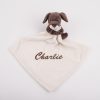 Brown puppy baby comforter head turned right and personalised with the name Reuben