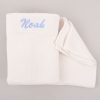 White knitted blanket embroidered with the name Noah