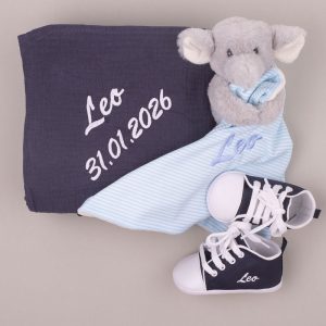 Personalised navy baby wrap, elephant comforter and shoes embroidered “Leo” with birth date.