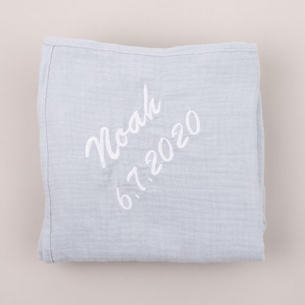 Personalised Light Blue Organic Muslin Wrap personalised with the name Noah