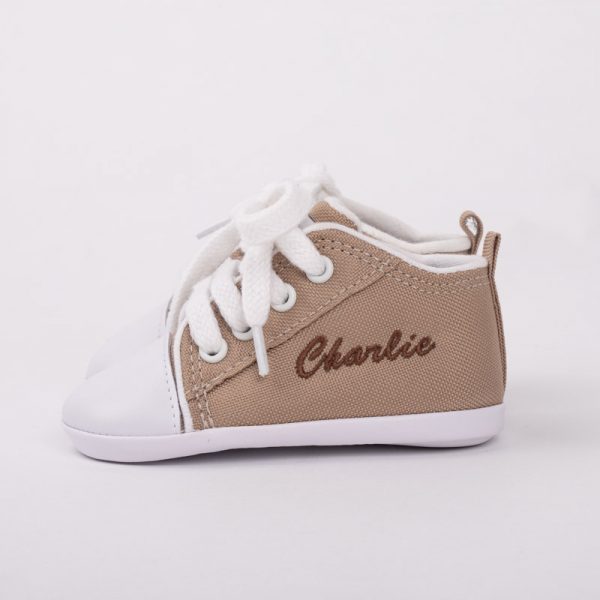 Sand coloured baby shoes personalised with the name Charlie