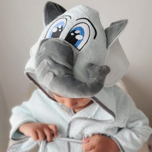 A toddler wearing a personalised Elephant Hooded Baby Robe personalised.