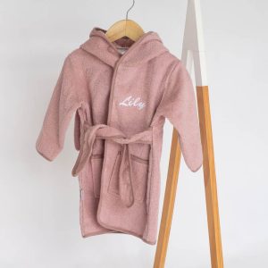 Personalised Pink Bunny Hooded Baby Robe embroidered with Lily in white thread, hanging on a hanger.