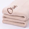 Beige Knitted Baby Blanket side on and embroidered with the name Oliver.