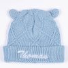 Personalised light blue knitted ear beanie with Thomas embroidered in white