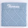 Personalised blue diamond knit baby blanket with white name embroidery on ribbed border