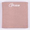 Blush Pink Knitted Baby Blanket Grace Folded Blush pink knitted personalised baby blanket with white embroidered script name on white background.