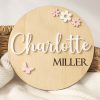 Flowers Butterfly Birth Announcement Disc A wood birth disc featuring acrylic flowers and butterflies with the name Charlotte.
