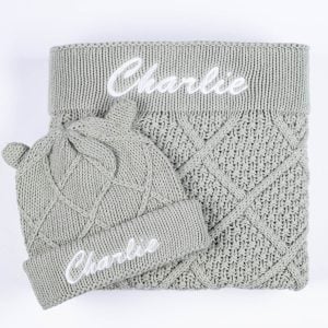 Sage green diamond knit blanket and ear beanie with Charlie embroidered in white