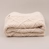 Personalised Diamond Knitted Blanket folder and side on.
