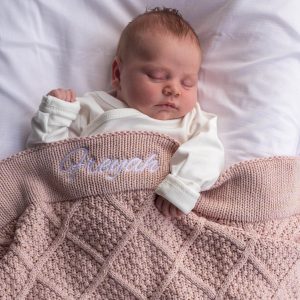 Pink Gold Diamond Knitted Baby Blanket White Text Freyah Sleeping