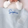 Powder Blue Blanket Embrodiered With The Name Sophie a personalised Powder Blue Blanket embroidered With The Name Sophie in bright blue text.