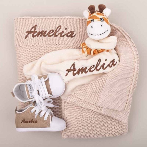 3 Pc Beige Giraffe Baby Gift Beige Knitted Blanket, Giraffe Comforter & Shoes Baby Gift embroidered in brown with the name Amelia.
