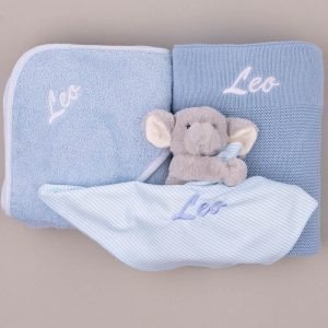 Personalized blue baby set with hooded towel, knitted blanket, and elephant comforter embroidered “Leo.”