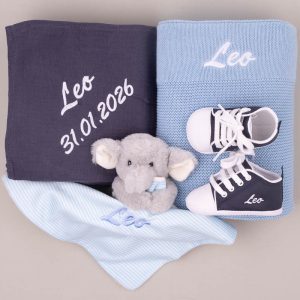 Personalized blue baby gift set with blankets, elephant plush, and navy shoes embroidered “Leo” and date.