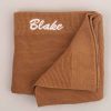 A Brown knitted baby's blanket personalised with the name Blake