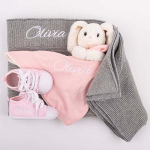 Grey Knitted Blanket, Bunny Comforter & Baby Shoes all personalised with the name Olivia