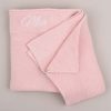 Pink Baby Blanket Mia Personalised Pink Knitted Blanket on grey background with Mia embroidered.