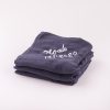 Navy Blue Organic Muslin Baby's Wrap personalised with the name Noah & folded