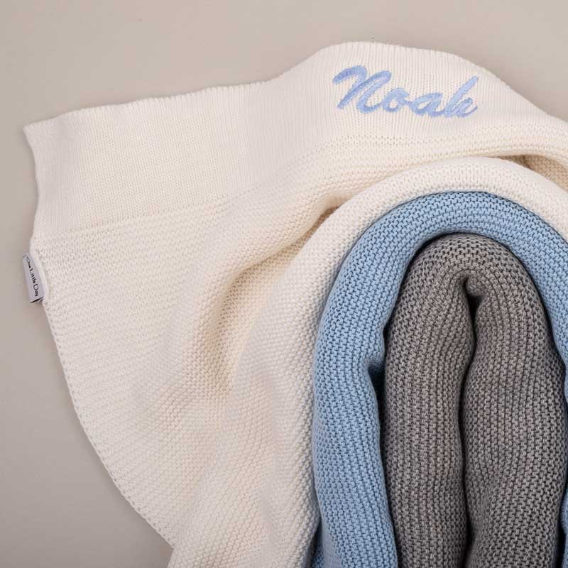Grey knitted blanket, blue knitted blanket & white knitted blanket personalised with Noah