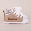 Sand coloured personalised baby shoes personalised with the name Maddison.
