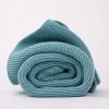 Personalised Ocean Blue Knitted Blanket for babies rolled up.