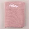 Blush Pink Knitted Blanket embroidere with the name Ruby using white thread.