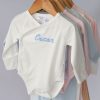 Organic-Baby-Rompers-Personalised-White-Hanging A Line-Up of100% GOTS Certified Organic Baby Rompers with Personalised Embroidery.