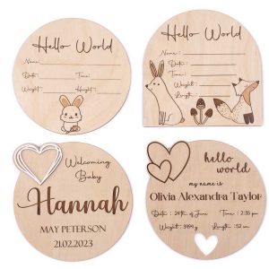 Four wooden birth announcement discs with space for baby details.