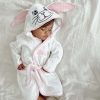 Baby wearing personalised white bunny robe 1 year old girl gift.
