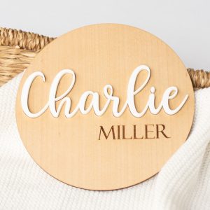 Wood and acrylic birth announcement disc with the name Charlie.
