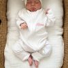 Baby Organic Cotton White Zip Onesie Remi Personalised white organic cotton zip onesie with Remi embroidered in pink on sleeping newborn in bassinet