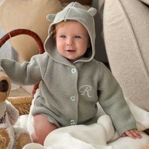 A Baby Wearing our Personalised Green Sage Hooded Cardgian.