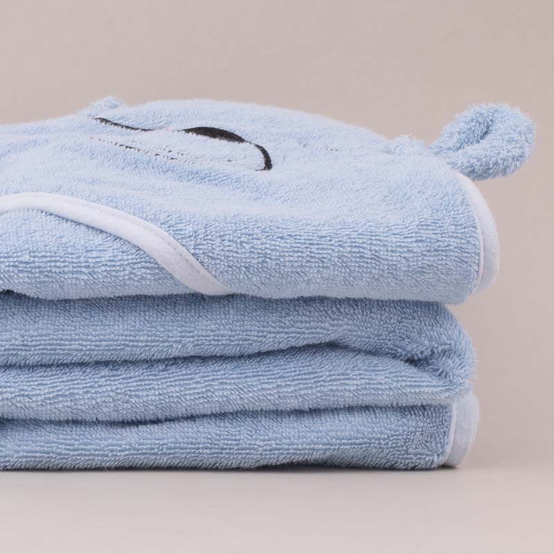 Personalised blue bear hooded towel for newborn boys folded.