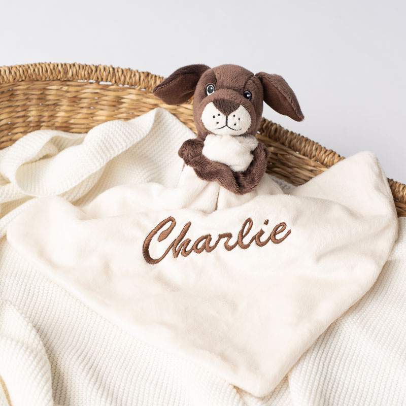 Personalised puppy baby comforter in a basket unisex gift idea.