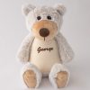 Personalised Teddy Bear A personalised teddy bear embroidered with the name George using brown thread.