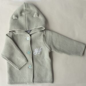 A Green Sage Hooded Knitted Baby Cardigan monogrammed with the letter H.