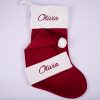 Burgundy Christmas Stocking & Hat Baby Gift Set Olivia Burgundy velvet personalised baby Christmas stocking and matching Santa hat with white cuffs, pompom and burgundy embroidered script name on white background.