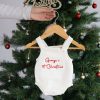 Personalised 1st Christmas White Knitted Newborn Romper. Geroge Personalised white knitted romper with Georgeβs 1st Christmas embroidered in red hanging on Christmas tree.