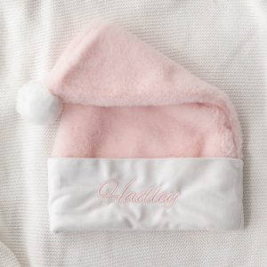 Personalised Pink Baby Christmas Hat Natural Light with the name Hadley embroided in Pink