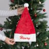 Personalised Red Christmas Hat Henry Personalised red faux fur Santa hat with white cuff and Henry embroidered in red with pom pom.
