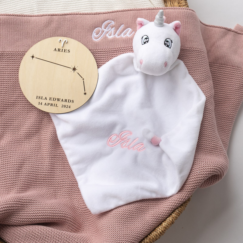 Personalised unicorn comforter and blush pink knitted blanket with zodiac birth plaque for baby Isla Edwards.