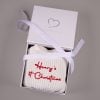 White 1st Christmas Long Sleeve Romper Box White knitted personalised 1st Christmas baby romper folded in open One Little Day gift box with white ribbon bow.