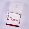 Burgundy personalised Christmas stocking folded in open One Little Day gift box with white ribbon bow.