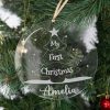 Personalised clear acrylic Christmas Disc engraved with My First Christmas Amelia hanging on tree with tree design.