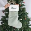 Personalised Sage Green Christmas Stocking Thomas Personalised sage green velvet Christmas stocking with white cuff and Thomas embroidered in green.